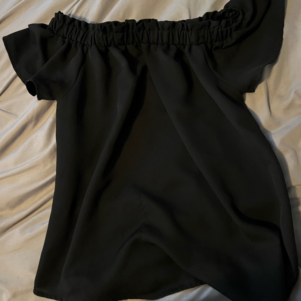 Black top can be worn as a cute tee or off the shoulder